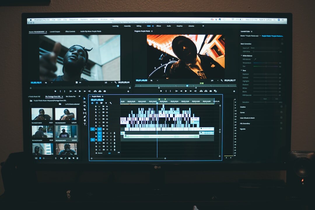 Video editor working at a desk with multiple monitors showing footage timelines
